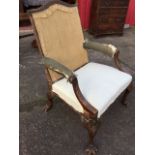 An eighteenth century walnut Gainsborough library armchair with arched back and padded arms