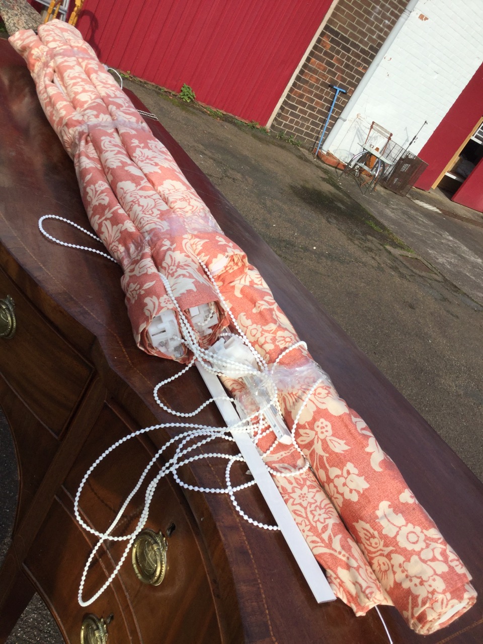 Four printed cotton blinds of floral design on red ground, removed from house complete with cords, - Image 3 of 3