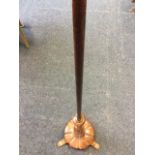 A 5ft Victorian rosewood polescreen column above a turned baluster raised on circular segmented base