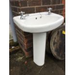 A bowfronted Barrhead handbasin on pedestal, fitted with chrome hot & cold labelled taps.