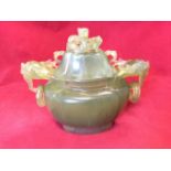 A carved jade censor & cover, the oval ribbed vessel having horned beast ring handles, the lid