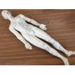 A 60s acupuncturists doll indicating the various points of piercing, with Chinese characters and