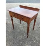 A Victorian mahogany side table with upstand to rectangular top above twin knobbed frieze drawers,