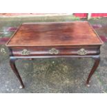 A large Georgian mahogany silver table, the cut-corner tray top above a cushion moulded frieze