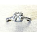 An 18ct white gold asscher cut diamond ring, the square diamond weighing under half a carat,