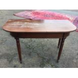 A nineteenth century mahogany table, formerly the end of a dining table, the 'D' shaped top with