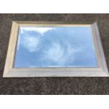 A contemporary rectangular mirror with bevelled plate in angled gilt frame. (36in x 26in)