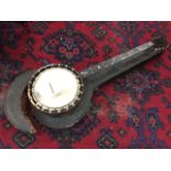 A cased Victorian banjo, the rosewood drum inlaid with boxwood stringing, having ebonised