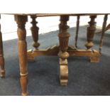 A Victorian oak dining table, the draw-leaf top extending with turned drop legs on casters, the