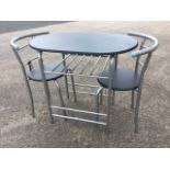 A modern small rectangular rounded kitchen table, with a pair of matching chairs with circular