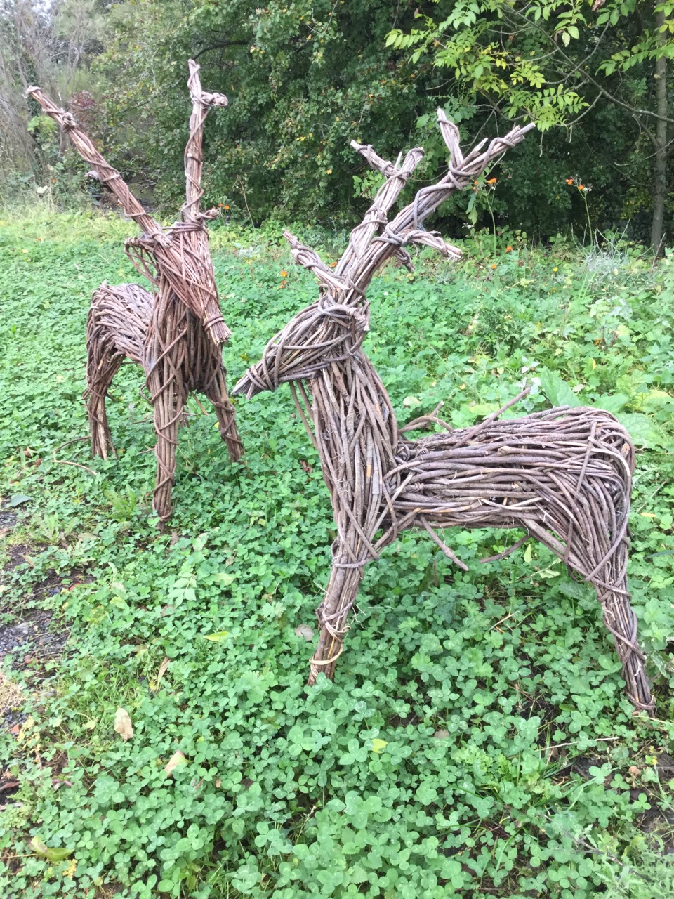 A pair of stickwork deer. (26in x 41in) (2)