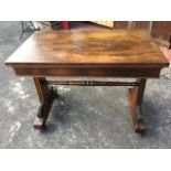 A Gillow style rosewood library table, the rectangular top above a plain frieze supported on