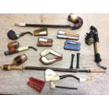 A collection of smokers pipes and cheroot holders - some cased - carved, one Birmingham silver