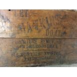 An Edwardian pine removal box with hinged Iid, advertising Hawkins Furniture Removals of Bristol,