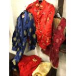 A Japanese gilt dragon embroidered red cotton kimono; a Chinese quilted silk jacket with floral