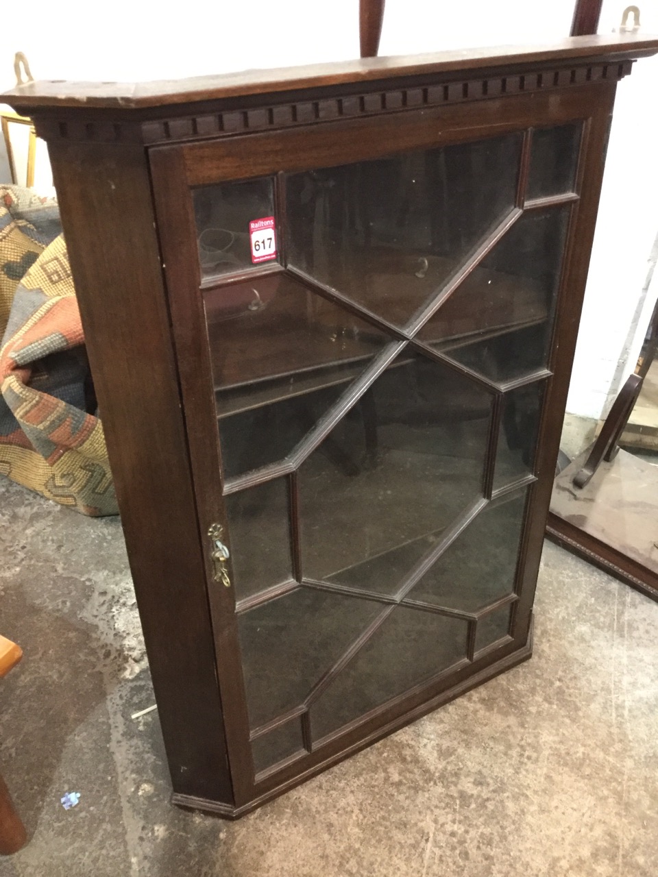 A stained mahogany corner cabinet with moulded dentil cornice above astragal glazed door enclosing - Image 3 of 3