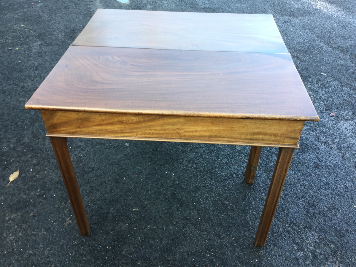 A nineteenth century mahogany turn-over-top tea table, the rectangular twin flaps above a plain - Image 2 of 3