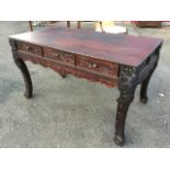 A nineteenth century Chinese hardwood side table the rectangular top with foliate scroll carved edge