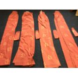 A set of four lined curtains printed with leaf sprigs on salmon ground, complete with tiebacks. (