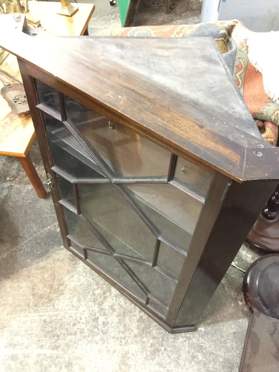 A stained mahogany corner cabinet with moulded dentil cornice above astragal glazed door enclosing - Image 2 of 3