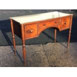 A Victorian mahogany dressing table by Gillow, the rectangular ribbed top with projecting rounded