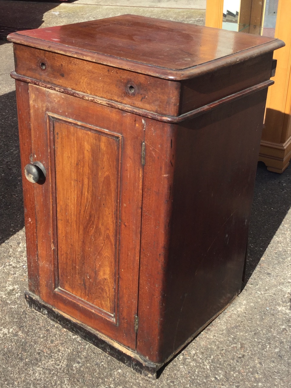 A nineteenth century mahogany washstand cabinet, the moulded top with dummy drawer revealing an