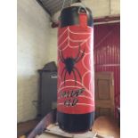 A Spider Kid punch bag, the tubular cushion with strap hooks. (31In)