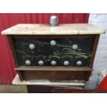 An oak soda fountain, the counter top dispenser with chrome mounts having marble slabs and glass