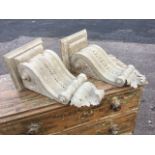 A pair of Victorian carved pine corbels, the fluted scrolls with leaf carving supporting rectangular
