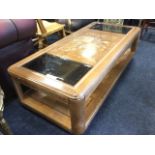 A walnut parquetry coffee table, the rectangular rounded top with glass panels set with silvered