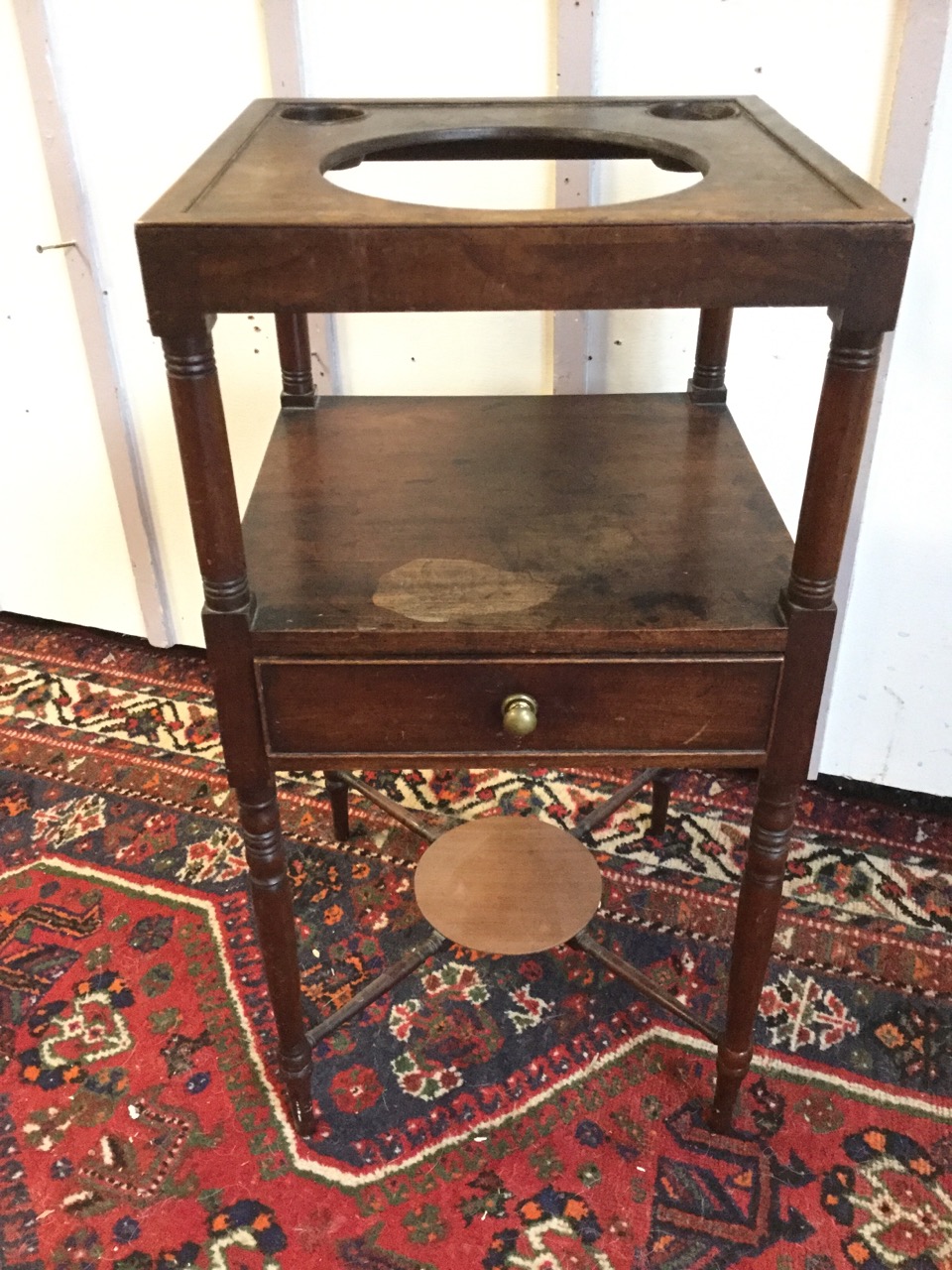 A square Georgian mahogany washstand, the tray top pierced for bowls supported on turned legs, the - Image 2 of 3