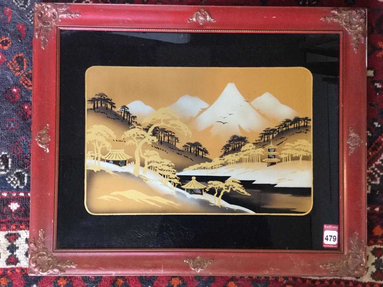 Vietnamese school, reverse glass mother of pearl inlaid gilt landscape, with mountains & lake in