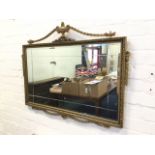 An Adam style gilt mirror, the rectangular plate with bevelled cuttings in gilded egg-and-dart frame