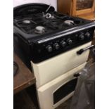 A Leisure range style gas/electric cooker, with four hobs above a Gourmet Classic double oven. (23.