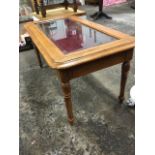 A bijouterie table, the rectangular moulded crossbanded top with bevelled glass panel on brass