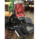 A Quinny childs buggy, the collapsible pushchair with carrycot, Maxicosi car seat, covers, etc. (A