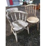 An elm seated captains chair with rounded back on ring-turned spindles, the solid seat raised on