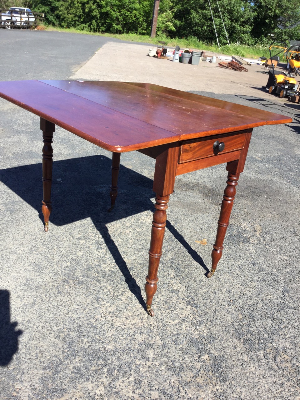 A Victorian mahogany drop-leaf table, having cockbeaded knobbed frieze drawer, raised on turned legs - Image 3 of 3