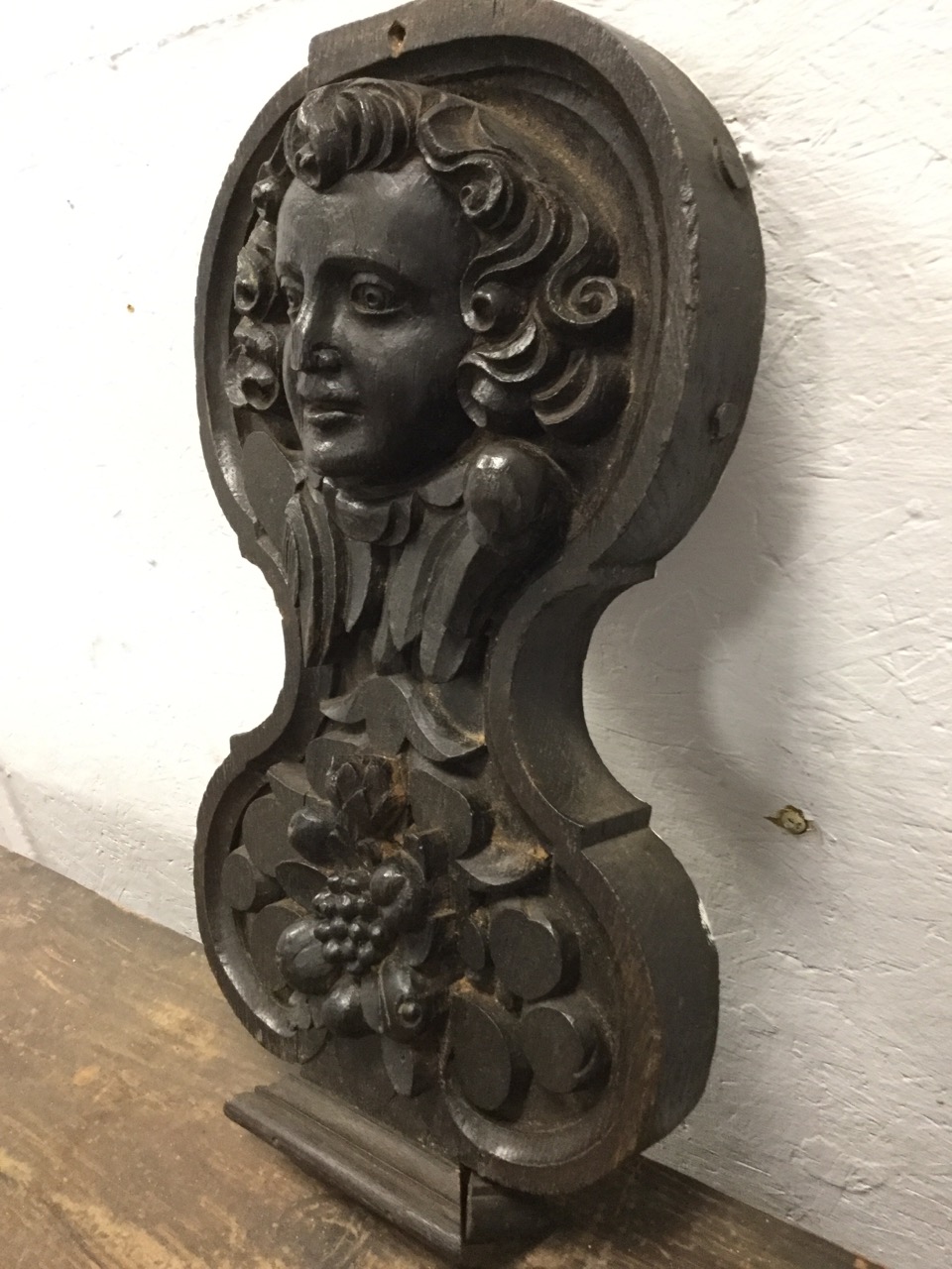 A Victorian carved oak panel, the waisted piece with eighteenth century style head above a fruit - Image 3 of 3