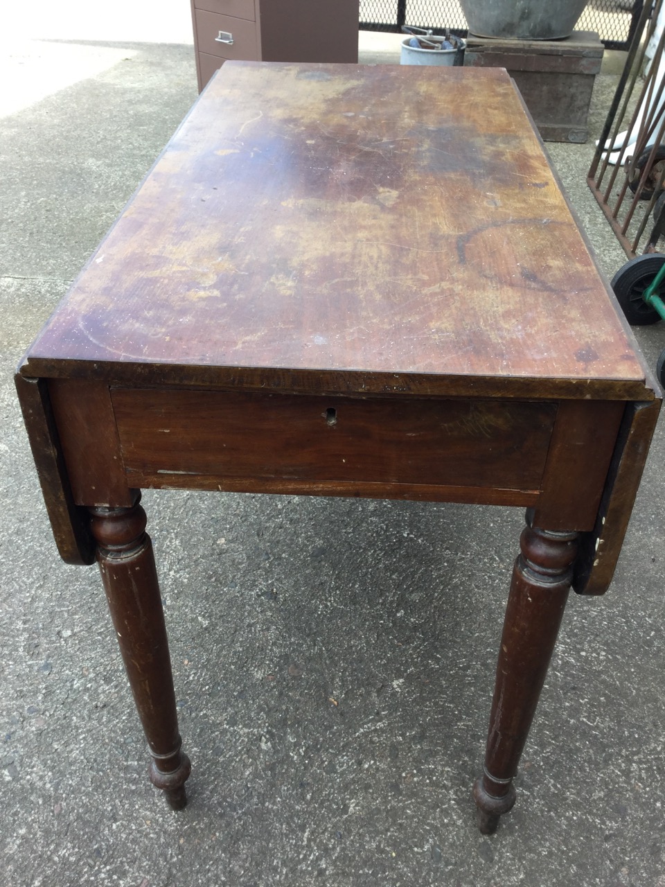 A Victorian mahogany pembroke table with two rounded drop leaves and frieze drawer, raised on turned - Image 3 of 3