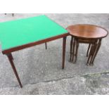 A nest of three oval mahogany scalloped top tables on carved slender legs with pad feet; and a