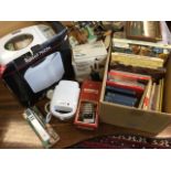 A box of cookery books and other volumes - maps, clothbound classics, etc; a boxed Russell Hobbs