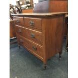 A late Victorian mahogany chest of drawers, the moulded rectangular top above two short and two long