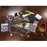 A quantity of miscellaneous jewellery including a coral necklace, beads, glass, some ivory, a cut-