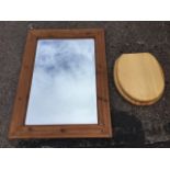 A rectangular pine cushion framed mirror with bevelled plate; and a pine bog seat with chrome