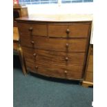 A nineteenth century mahogany bowfronted chest of drawers, the moulded top above two short and three