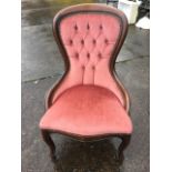 A Victorian style button upholstered spoonback chair, the rounded moulded frame with brass
