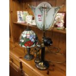 A Tiffany style leaded glass tablelamp with dragonfly shade on fluted leaf cast brass column; and an