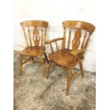 Two fiddleback country kitchen chairs, one a carver, having pierced splats framed by spindles
