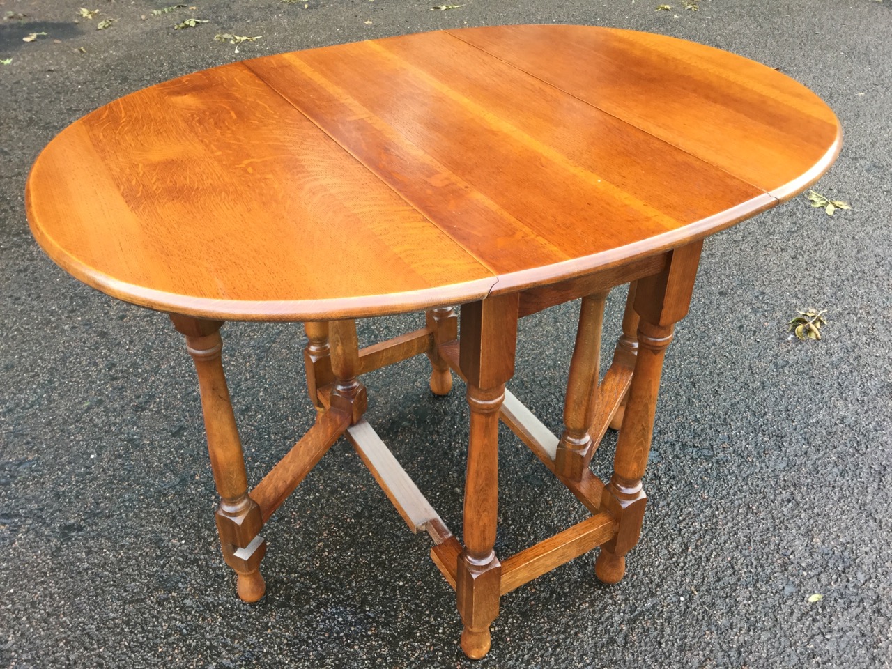 An oval oak gateleg dining table, the moulded top with two drop-leaves raised on baluster turned - Image 2 of 3